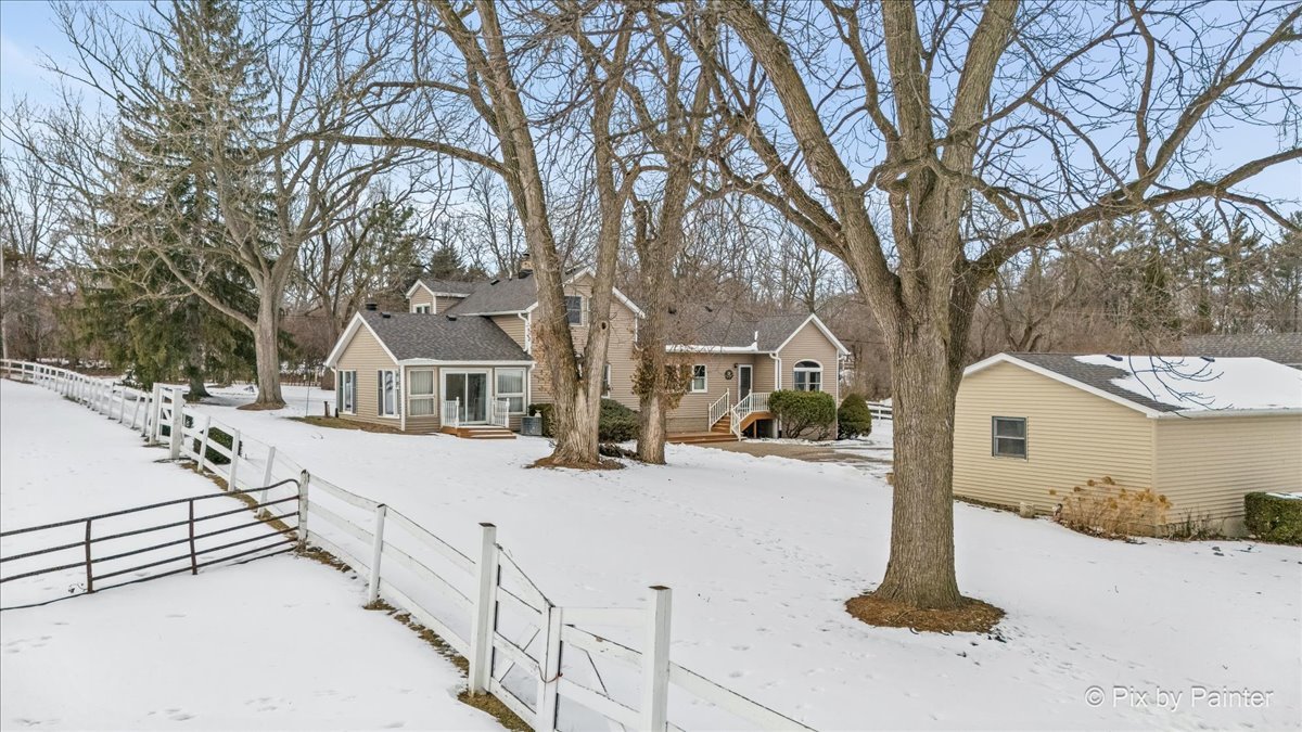 11N575 Rohrssen Road Elgin, IL 60120 - Photo 52 of 58 a view of a house with snow on the road