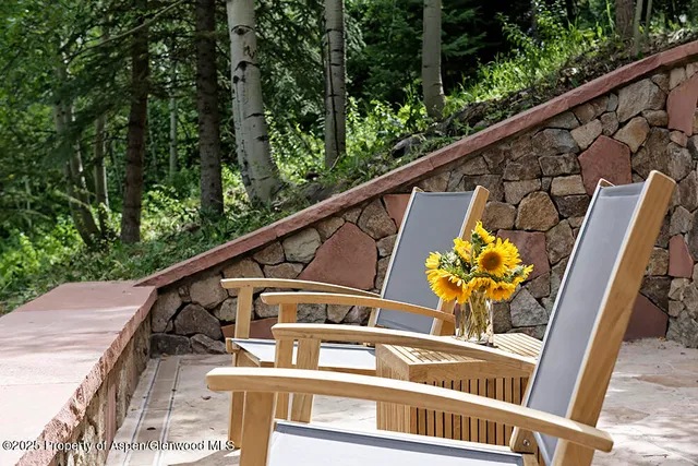 a view of balcony with furniture