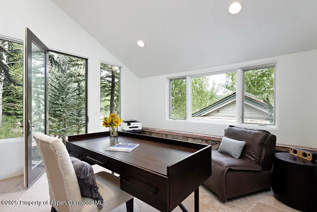 a view of a dining room with furniture window and outside view