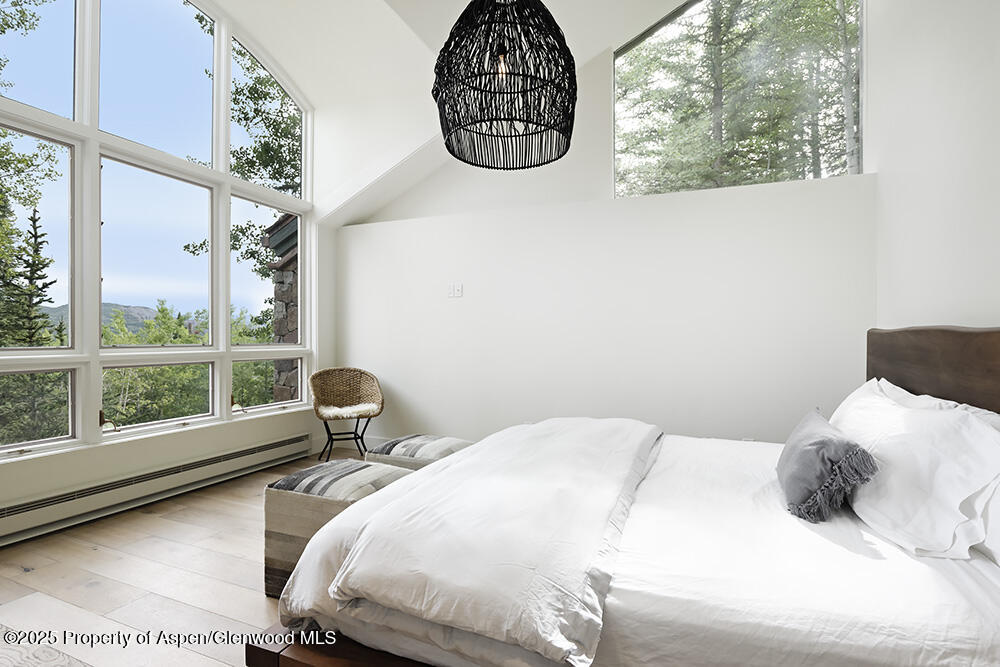 333 Faraway Road Snowmass Village, CO 81615 - Photo 19 of 29 a bedroom with a bed and a window