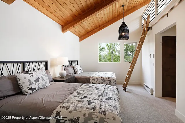 a bedroom with bed and a window