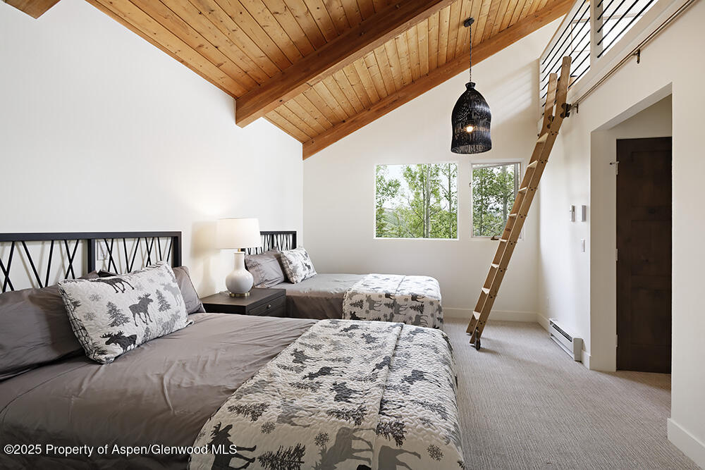 333 Faraway Road Snowmass Village, CO 81615 - Photo 22 of 29 a bedroom with bed and a window
