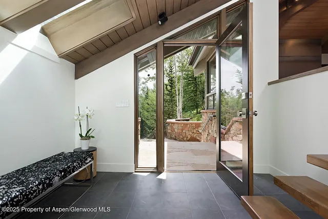 a view of an entryway with wooden floor