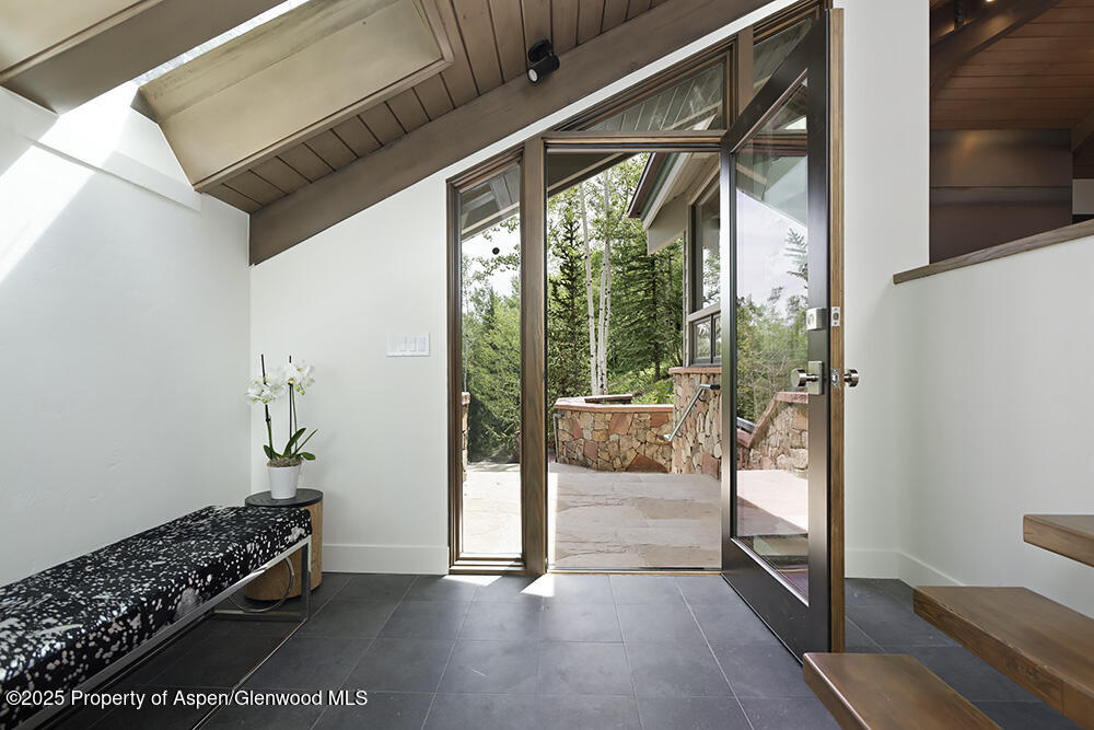 333 Faraway Road Snowmass Village, CO 81615 - Photo 26 of 29 a view of an entryway with wooden floor