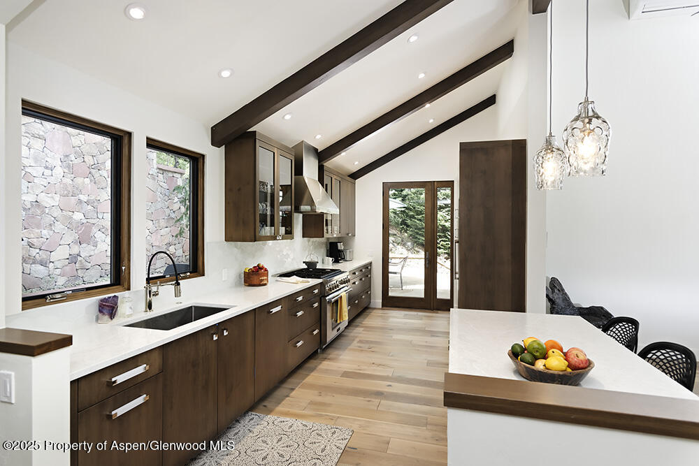 333 Faraway Road Snowmass Village, CO 81615 - Photo 3 of 29 a large white kitchen with a large window