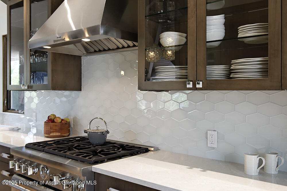 333 Faraway Road Snowmass Village, CO 81615 - Photo 5 of 29 a kitchen with stainless steel appliances granite countertop a stove and a microwave