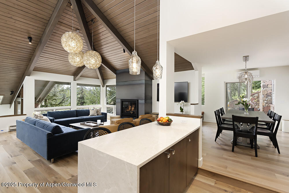 333 Faraway Road Snowmass Village, CO 81615 - Photo 6 of 29 a kitchen with a sink a stove and chairs