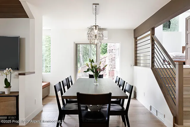 a view of a dining room with furniture window and wooden floor