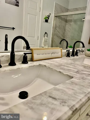 a bathroom with a bathtub and sink