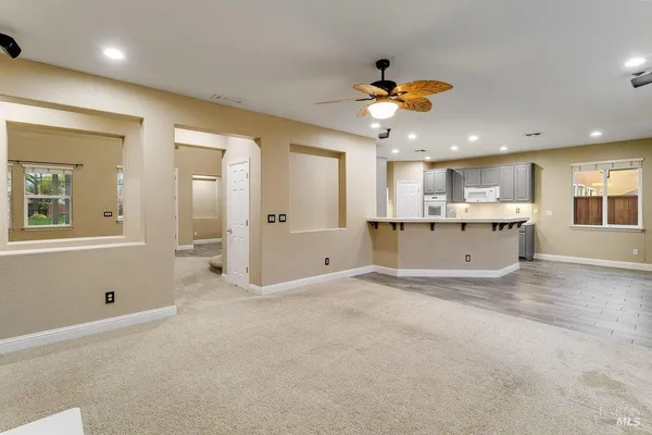 a view of empty room with window and fireplace