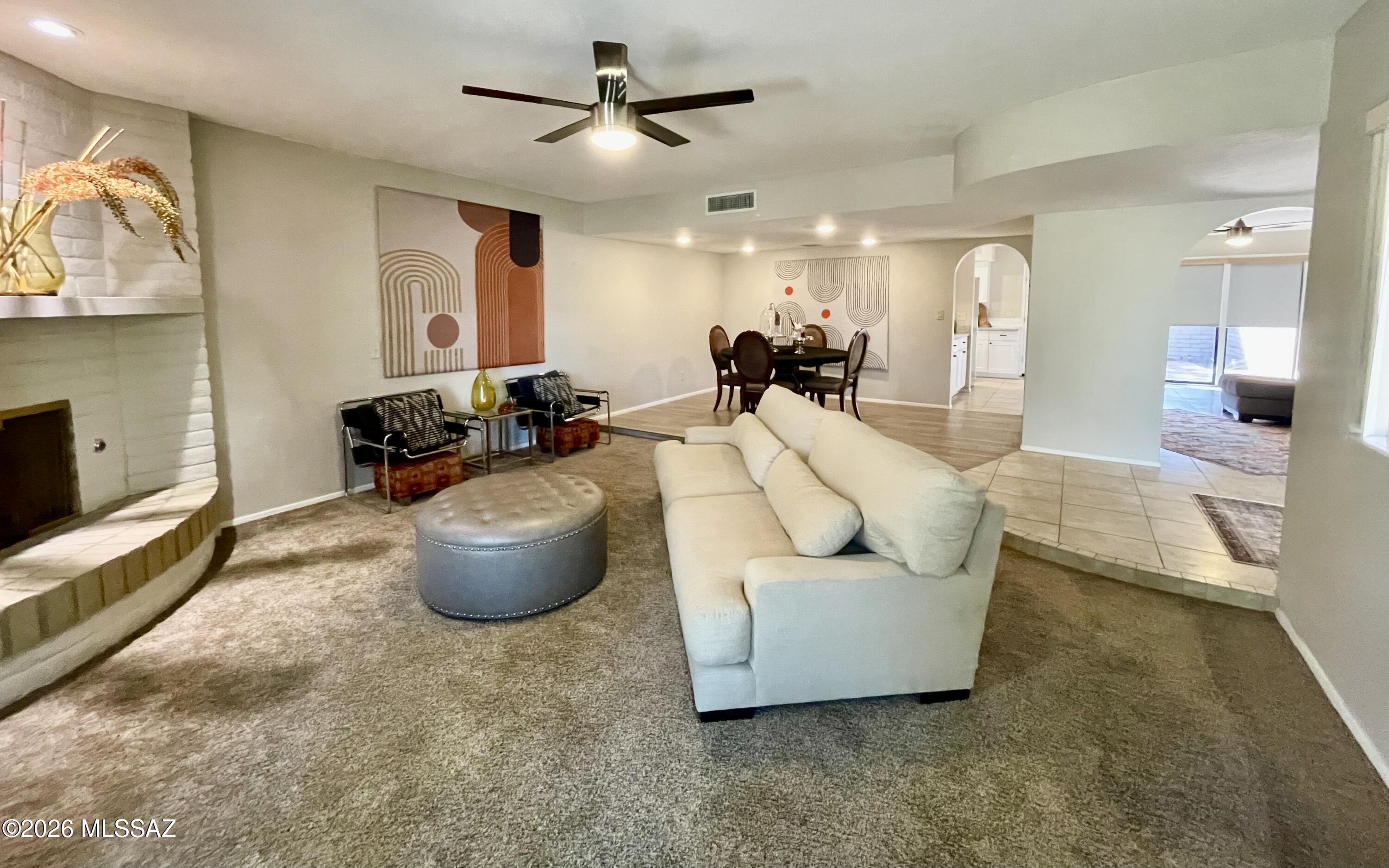 living room & dining room with fireplace