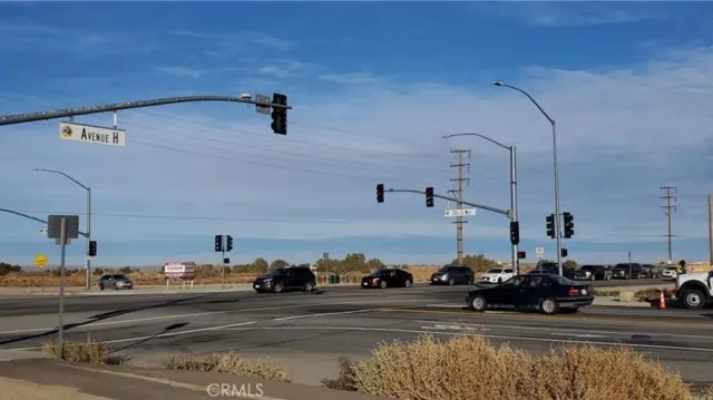a view of a city street with cars