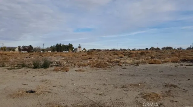 a view of ocean beach and mountain