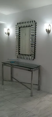 a bathroom with a granite countertop toilet a sink and shower