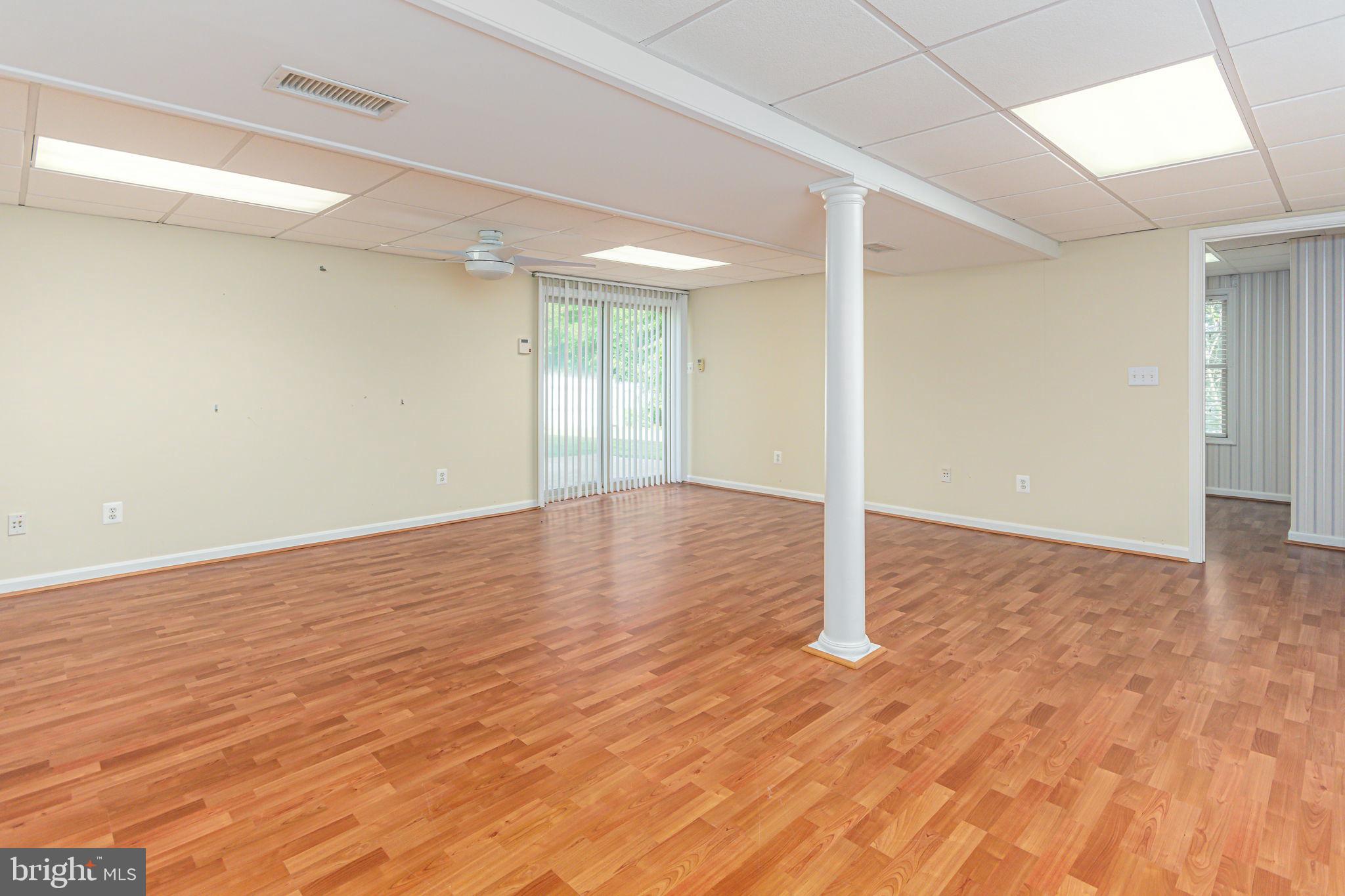 118 Queensberry Road Baltimore, MD 21237 - Photo 23 of 38 Great room sliders to side patio