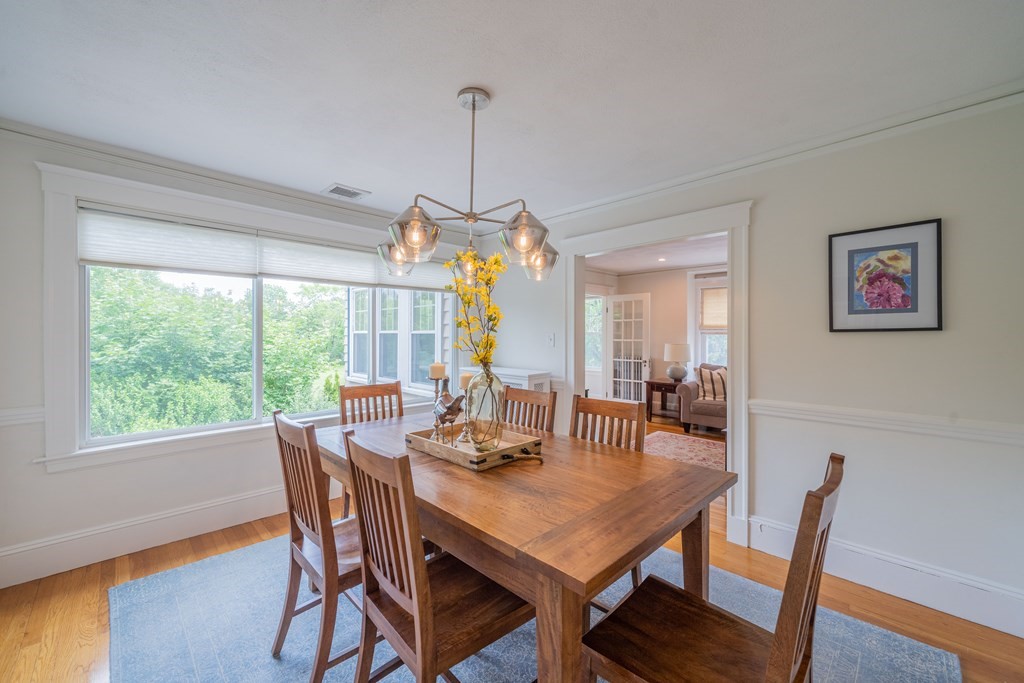 7 Maynard Street, Unit 2 Arlington, MA 02474 - Photo 13 of 42 a view of a dining room with furniture window and wooden floor