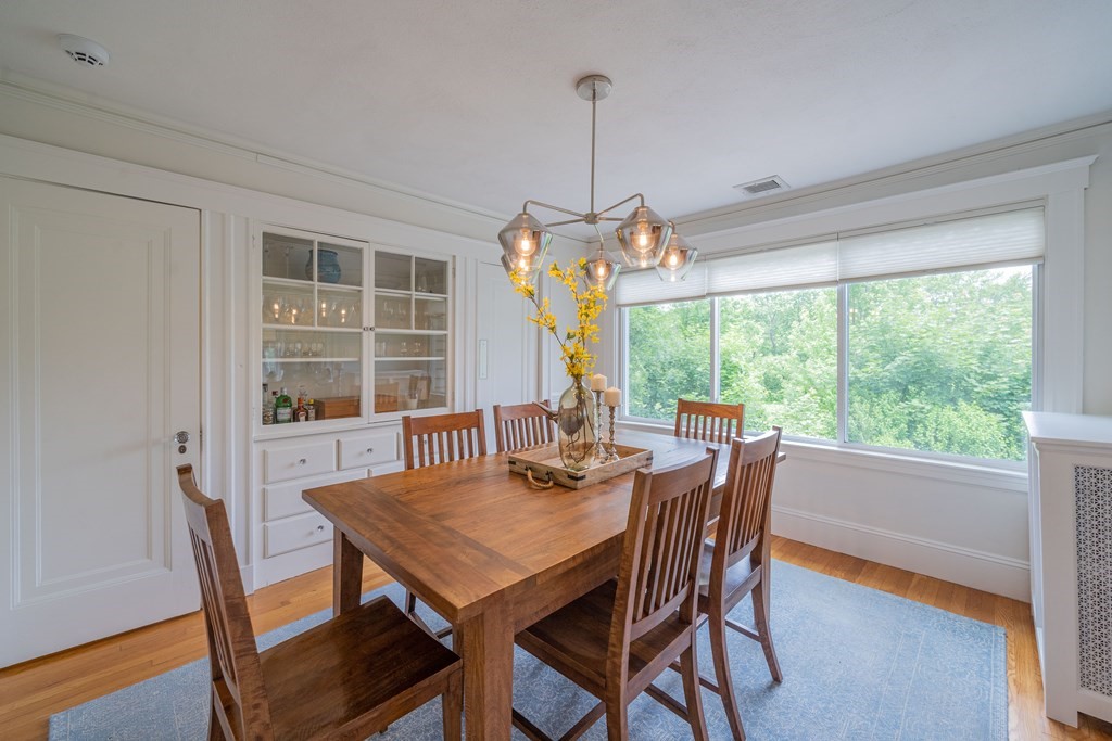 7 Maynard Street, Unit 2 Arlington, MA 02474 - Photo 14 of 42 a view of a dining room with furniture window and wooden floor