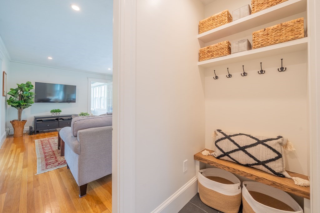 7 Maynard Street, Unit 2 Arlington, MA 02474 - Photo 2 of 42 a living room with furniture and a wooden floor