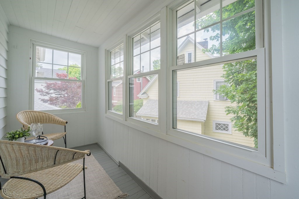 7 Maynard Street, Unit 2 Arlington, MA 02474 - Photo 22 of 42 a view of a chair and table in a room