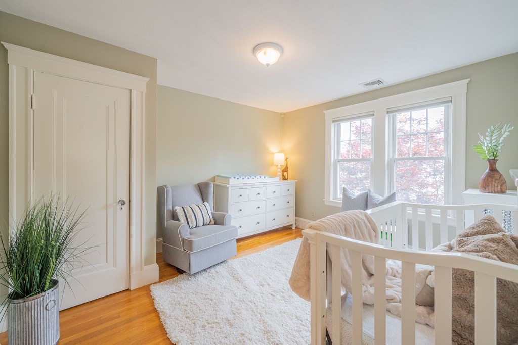 7 Maynard Street, Unit 2 Arlington, MA 02474 - Photo 23 of 42 a living room with furniture and a table