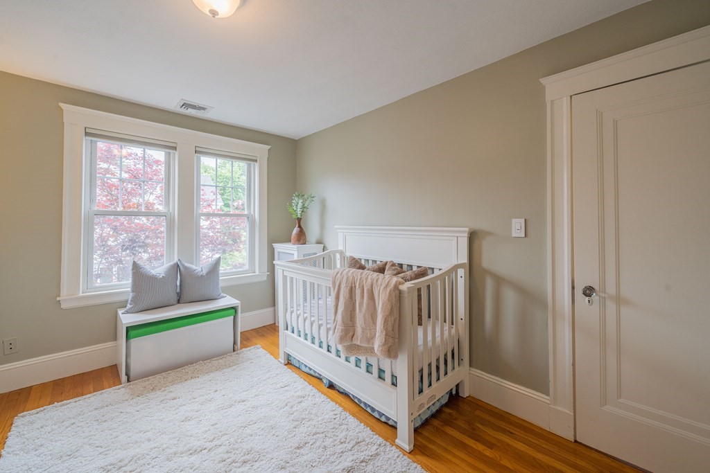 7 Maynard Street, Unit 2 Arlington, MA 02474 - Photo 24 of 42 a living room with furniture and a window