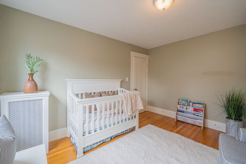 7 Maynard Street, Unit 2 Arlington, MA 02474 - Photo 26 of 42 a bedroom with furniture and a window
