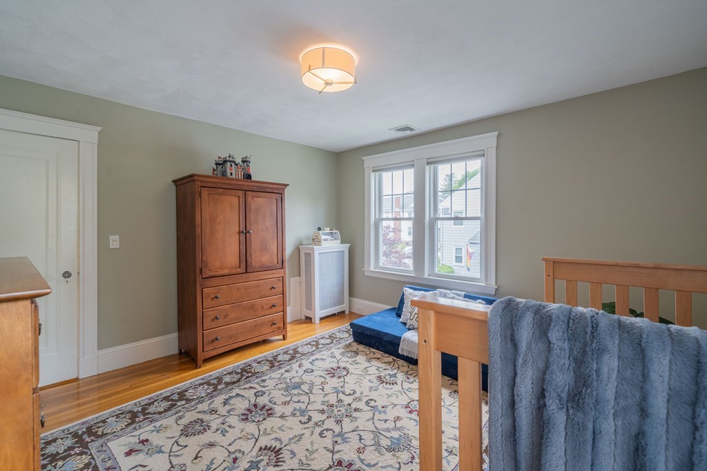 7 Maynard Street, Unit 2 Arlington, MA 02474 - Photo 32 of 42 a bedroom with furniture and a window