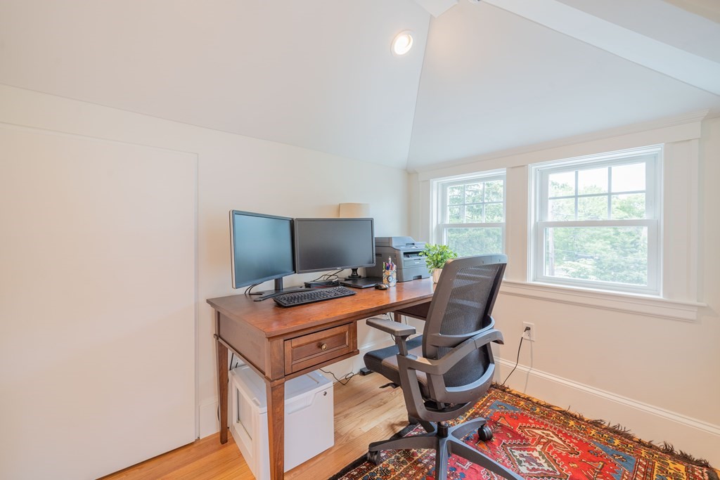 7 Maynard Street, Unit 2 Arlington, MA 02474 - Photo 34 of 42 a view of a workspace with furniture and a window
