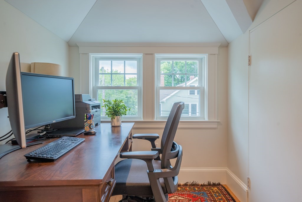 7 Maynard Street, Unit 2 Arlington, MA 02474 - Photo 35 of 42 a view of a workspace with furniture and a window