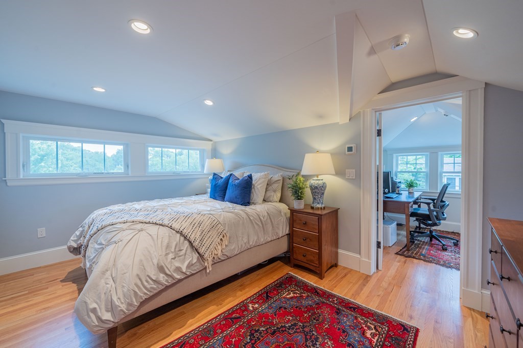 7 Maynard Street, Unit 2 Arlington, MA 02474 - Photo 38 of 42 a bed room with a bed and wooden floor