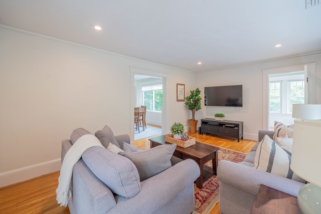 7 Maynard Street, Unit 2 Arlington, MA 02474 - Photo 4 of 42 a living room with furniture and a flat screen tv