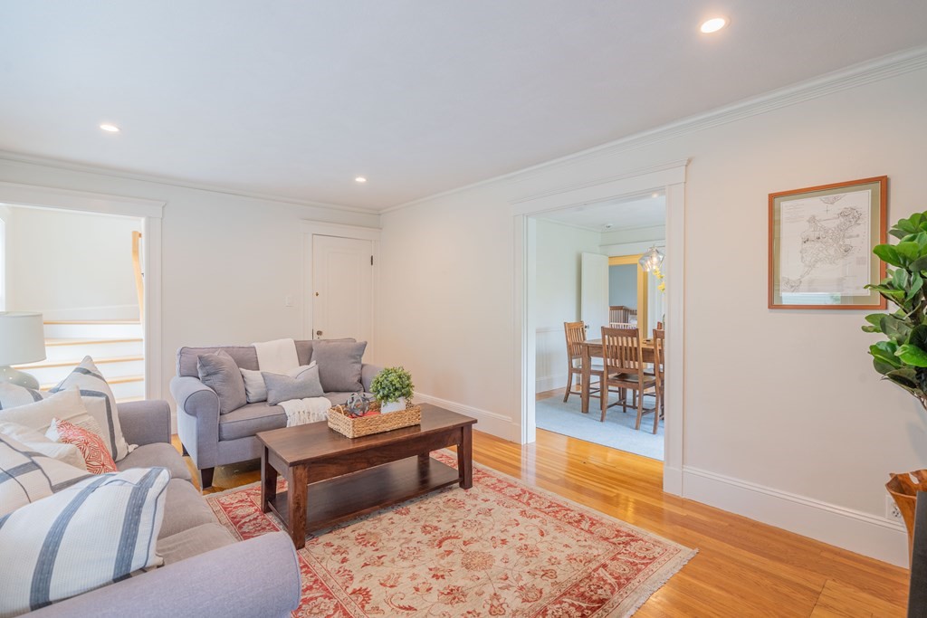7 Maynard Street, Unit 2 Arlington, MA 02474 - Photo 7 of 42 a living room with furniture and wooden floor