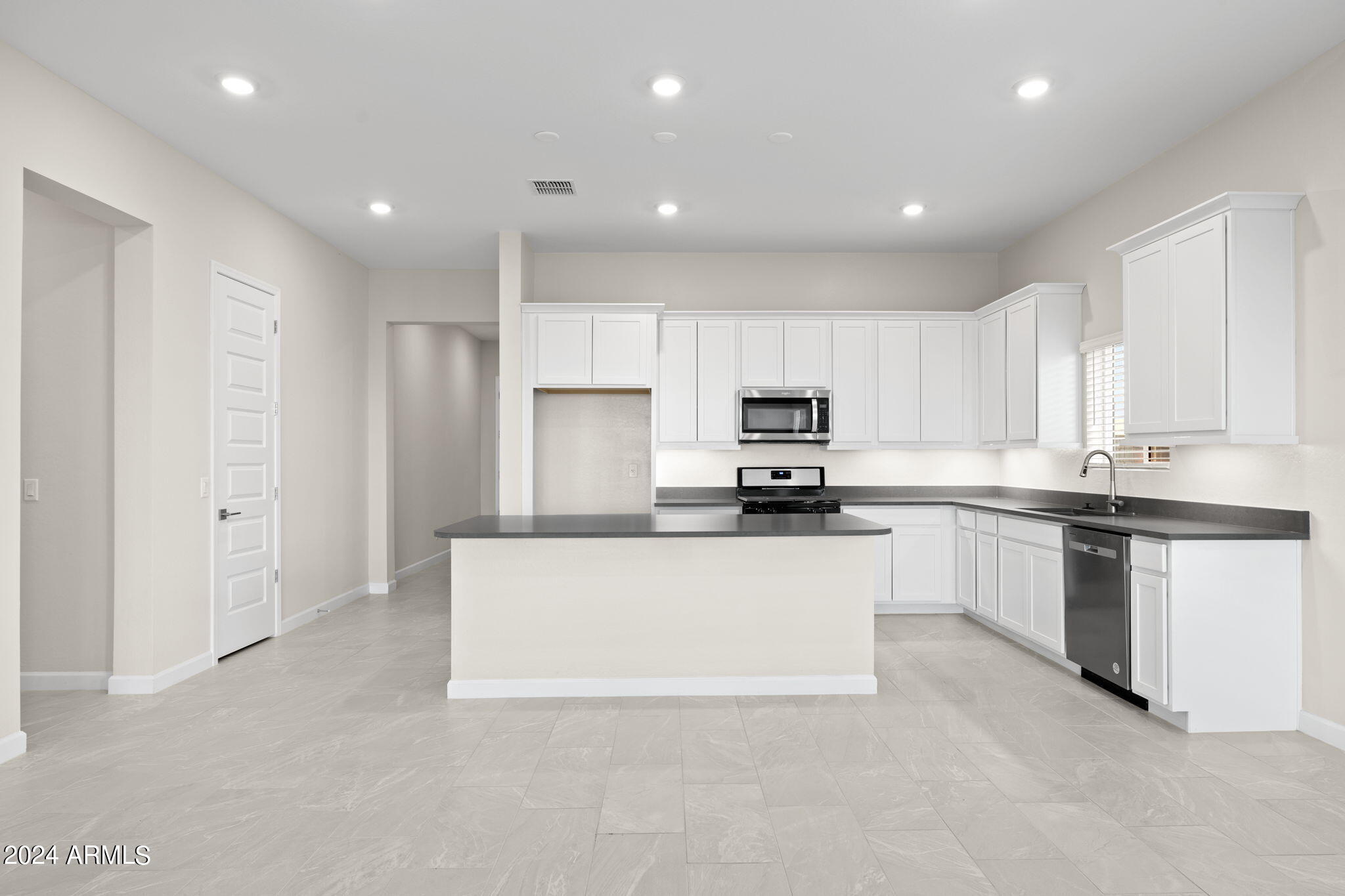 17706 West Hatcher Road Waddell, AZ 85355 - Photo 3 of 12 McCormick kitchen angle 1