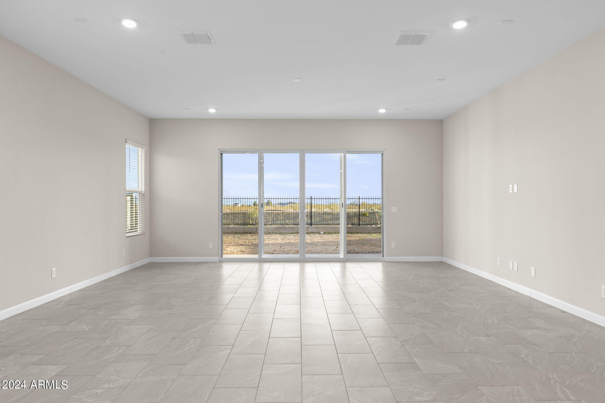 17706 West Hatcher Road Waddell, AZ 85355 - Photo 4 of 12 McCormick great room