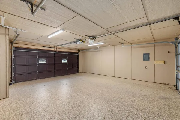 a front view of a house with a garden and yard