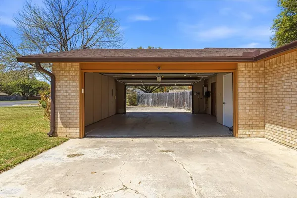 a front view of house with yard and trees