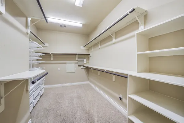 a view of an empty walk in closet