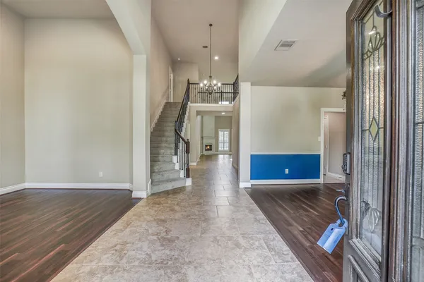 a view of a hallway view with wooden floor and staircase