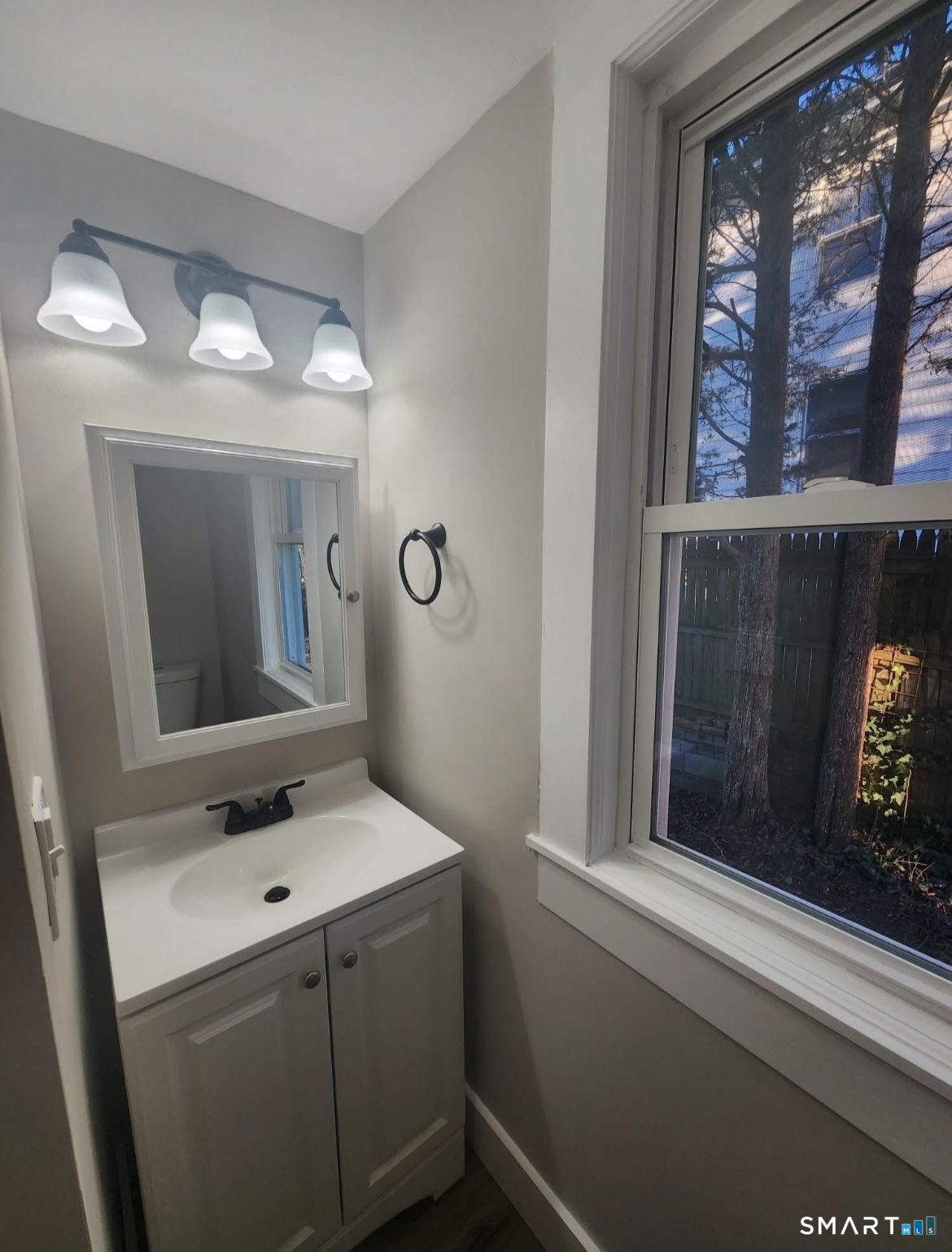 282 Ward Street Wallingford, CT 06492 - Photo 4 of 6 a bathroom with a sink and a mirror