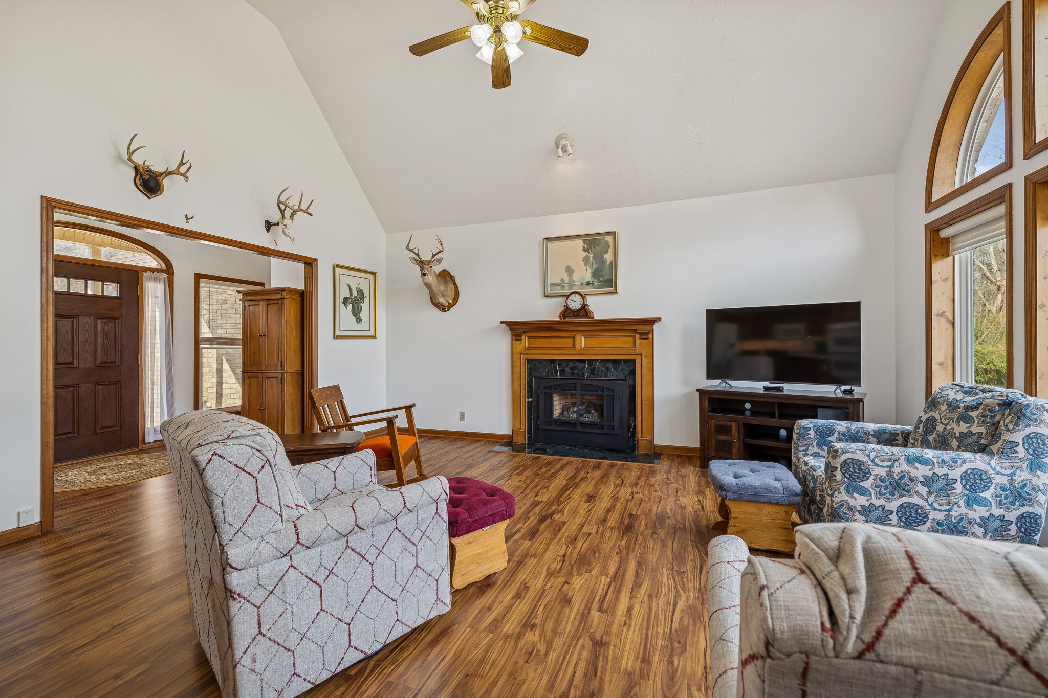 1457 Absher Branch Road Westmoreland, TN 37186 - Photo 11 of 74 a living room with furniture a flat screen tv and a fireplace