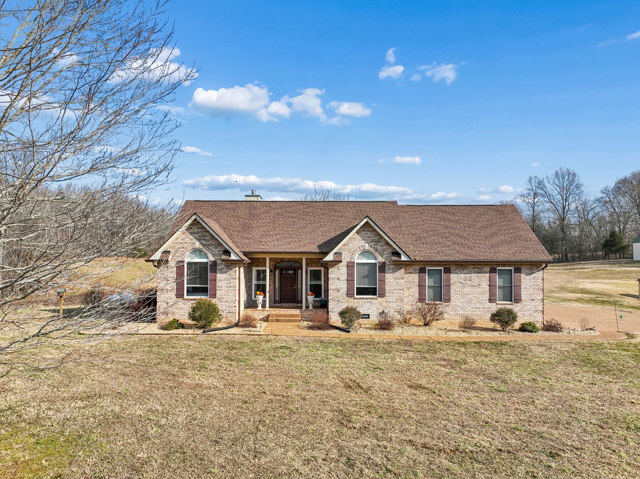 1457 Absher Branch Road Westmoreland, TN 37186 - Photo 2 of 74 a front view of a house with a yard