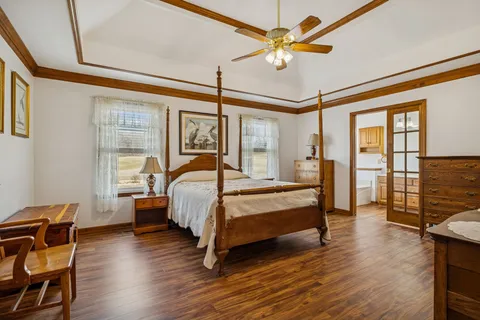 a bathroom with a granite countertop sink a mirror a vanity and bathtub