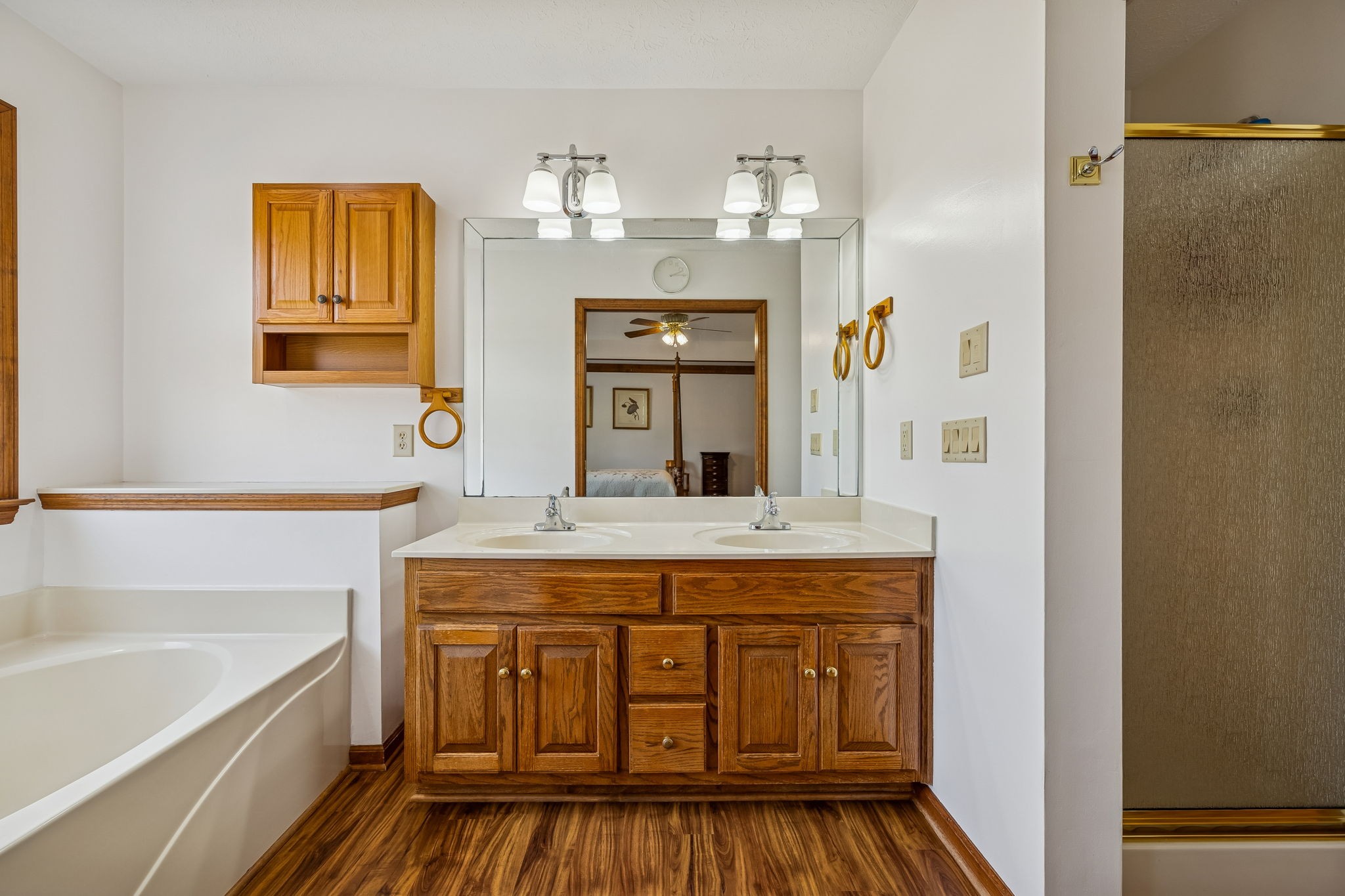 1457 Absher Branch Road Westmoreland, TN 37186 - Photo 26 of 74 a bathroom with a granite countertop sink a mirror a vanity and bathtub