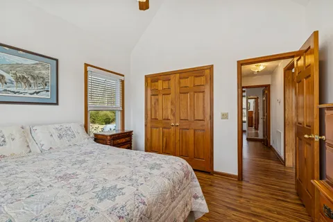 a view of a livingroom with wooden floor and a ceiling fan