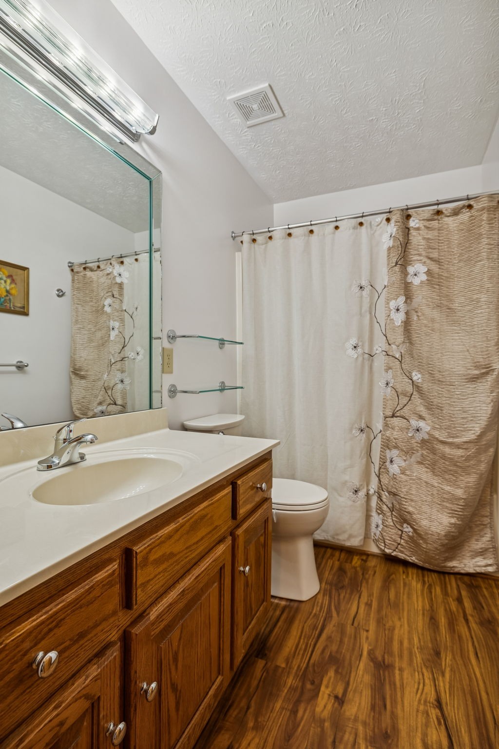 1457 Absher Branch Road Westmoreland, TN 37186 - Photo 31 of 74 a bathroom with a granite countertop sink toilet and shower