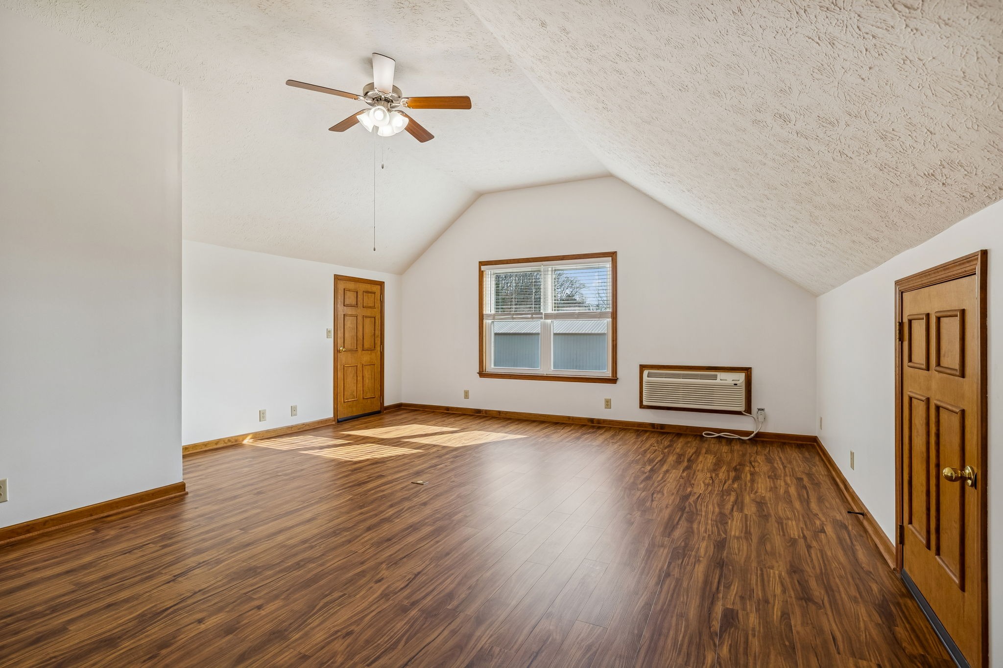 1457 Absher Branch Road Westmoreland, TN 37186 - Photo 34 of 74 a view of a livingroom with wooden floor and a ceiling fan