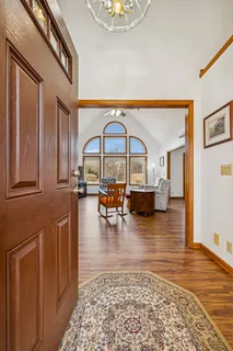a view of a entryway door with chandelier