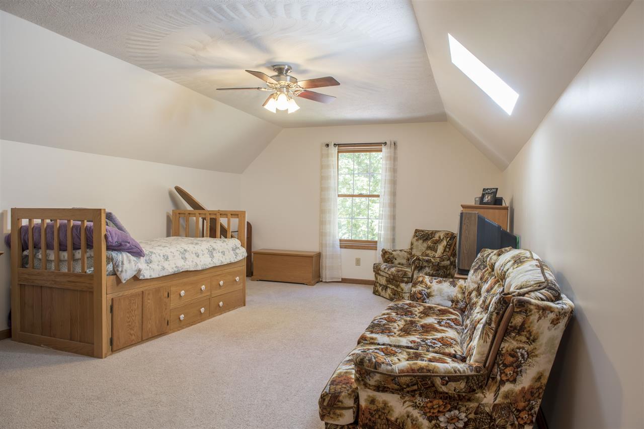 5979 Faughts Road Mount Crawford, VA 22841 - Photo 11 of 18 a bed room with a bed and a chandelier