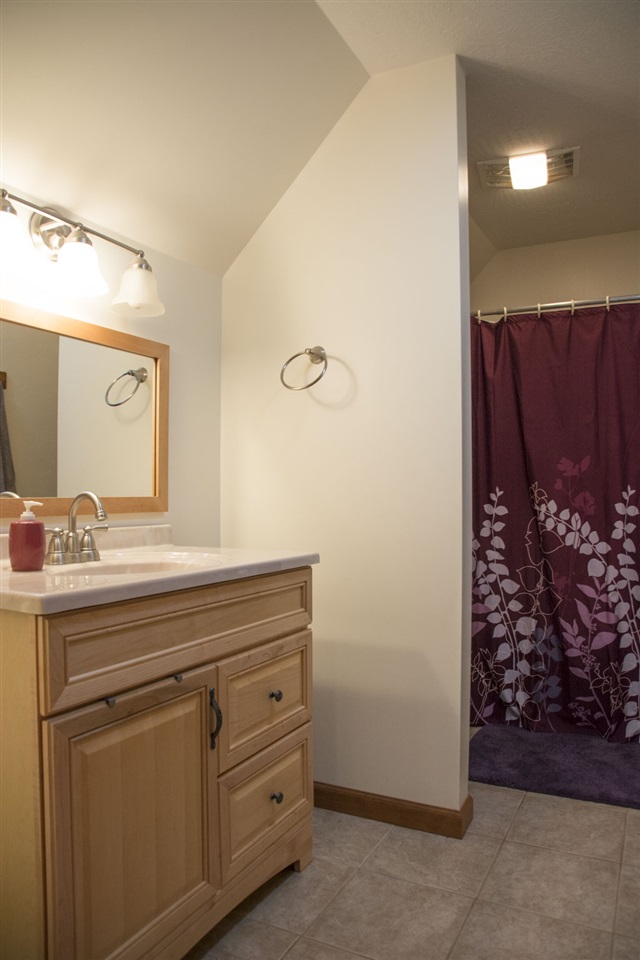 5979 Faughts Road Mount Crawford, VA 22841 - Photo 18 of 18 a bathroom with a granite countertop sink and a mirror