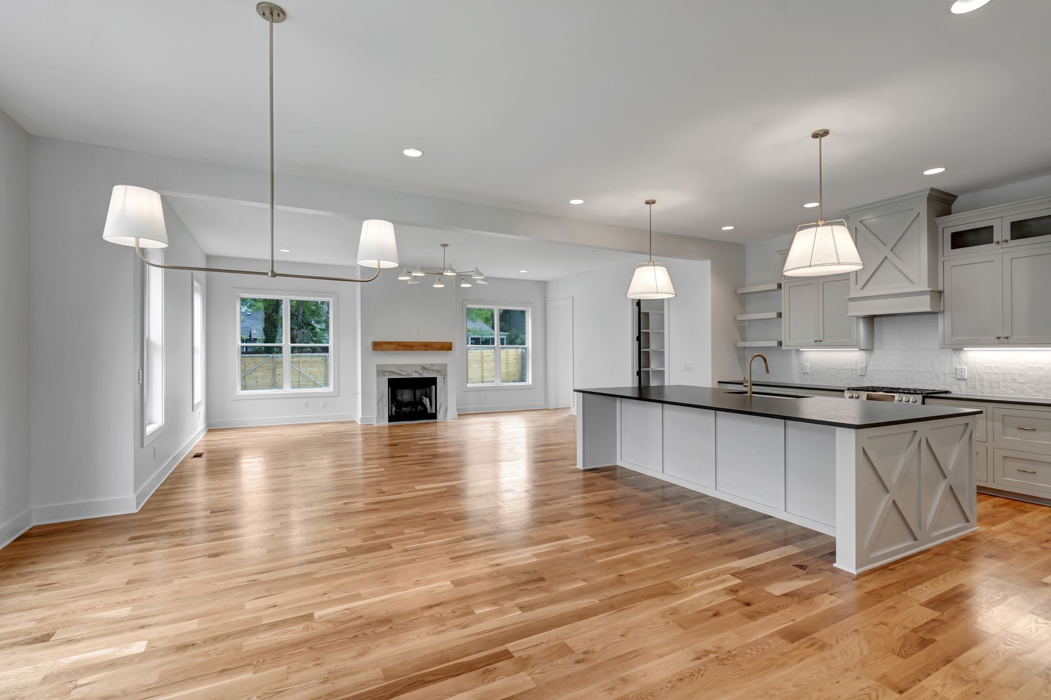 1826 Cephas Street Nashville, TN 37208 - Photo 12 of 35 a large kitchen with kitchen island a stove a sink a refrigerator and a fireplace